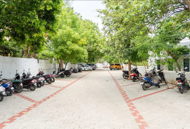 Spacious tree-lined parking at Sudar Hospital, Thanjavur